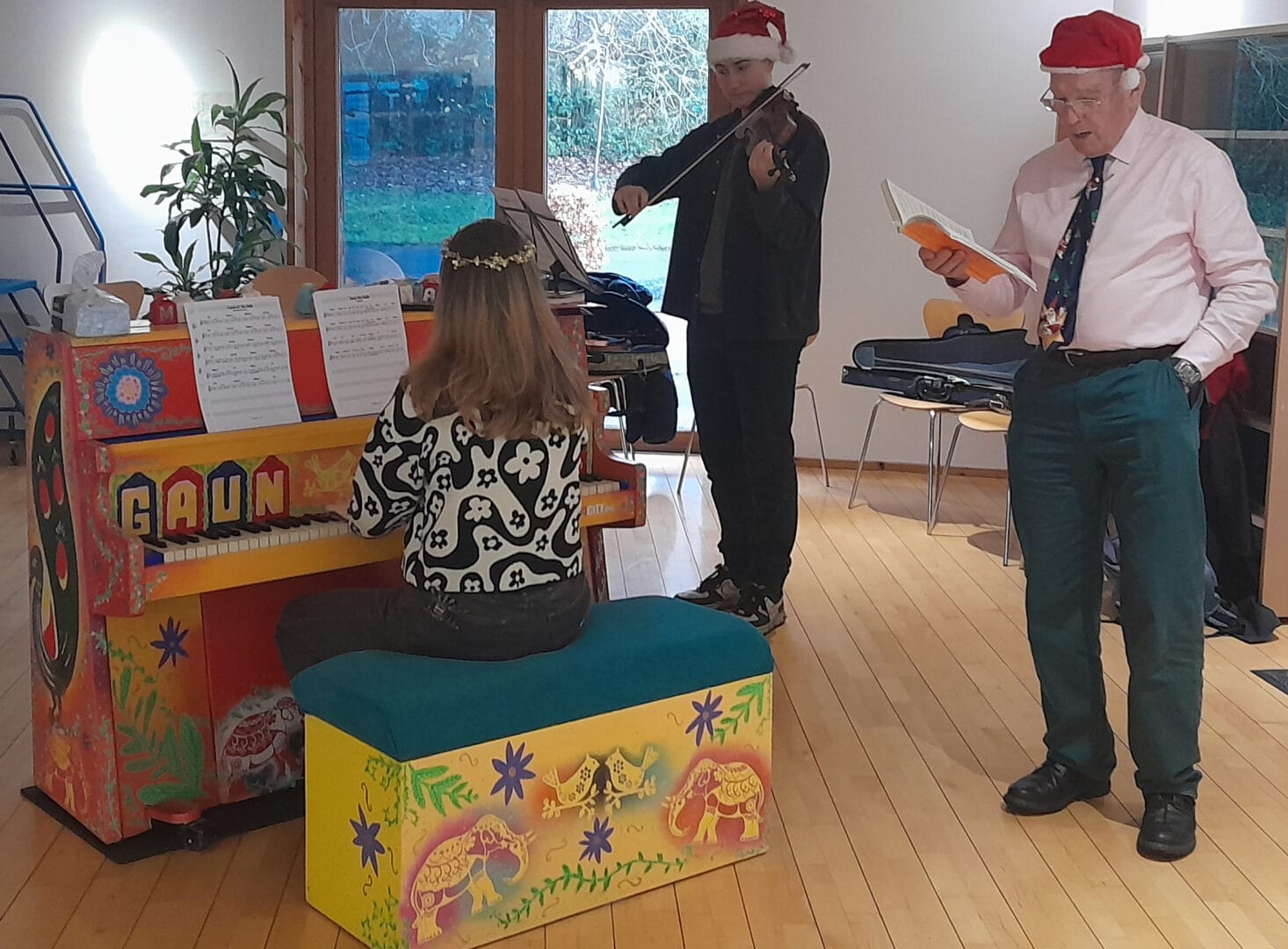 singing next to a piano at The Centre For Integrative Care Glasgow